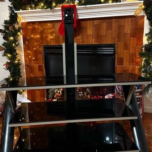 Sleek Black Glass Entertainment Stand